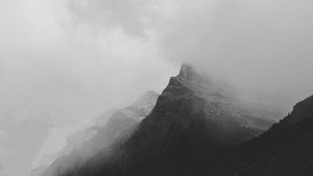 Misty Alpine Mountain Peak in Monochrome Desktop Wallpaper