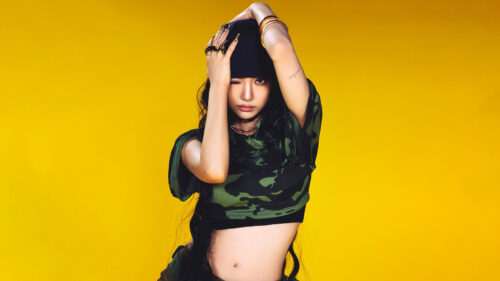 Stunning K-Pop Idol Lisa Blackpink Camouflage Outfit Yellow Background 4K Wallpaper