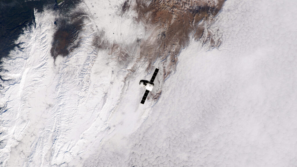 Satellite Orbiting Above Earths Snowy Landscape 4K Wallpaper