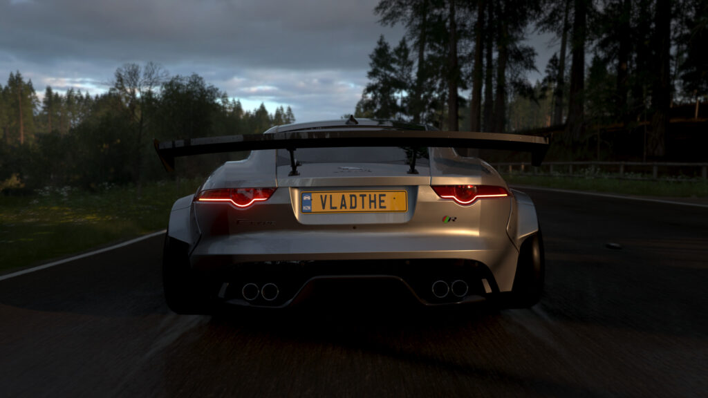 Widebody Jaguar F-Type R Racing Through Forest Landscape PC Wallpaper