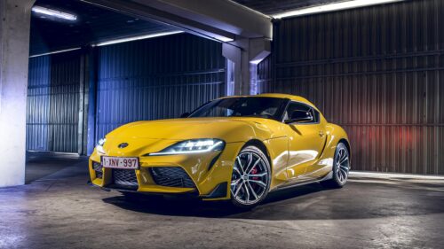 Stunning Yellow Toyota Supra GR in an Industrial Garage 4K Wallpaper