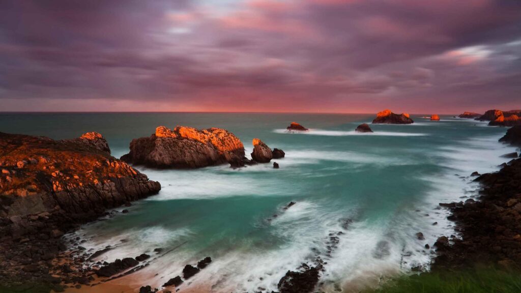 Stunning Coastal Sunset with Dramatic Golden Cliffs and Ocean Waves 4K Wallpaper