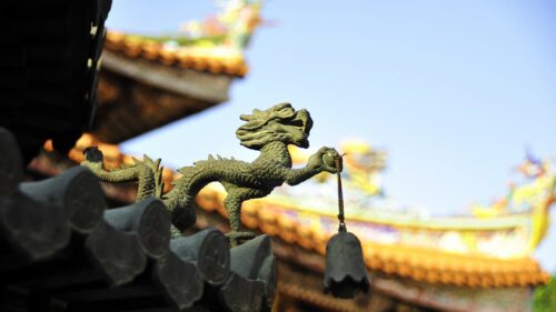 Ancient Bronze Dragon Statue on Traditional Chinese Roof Desktop Wallpaper