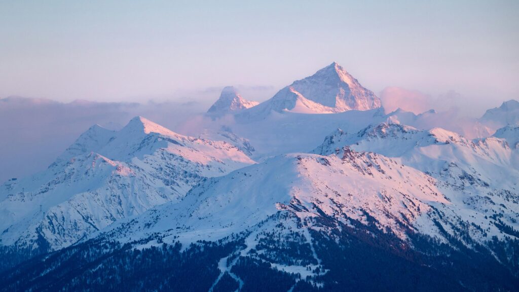 Majestic Snow Covered Alpine Peaks at Sunset 4K Desktop Wallpaper