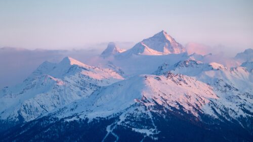 Majestic Snow Covered Alpine Peaks at Sunset 4K Desktop Wallpaper