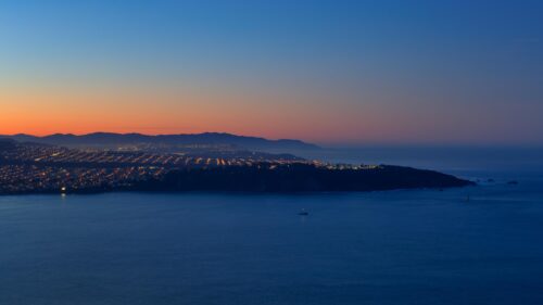 Stunning Coastal Cityscape at Twilight Overlooking the Pacific Ocean 4K Wallpaper