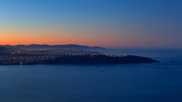 Stunning Coastal Cityscape at Twilight Overlooking the Pacific Ocean 4K Wallpaper