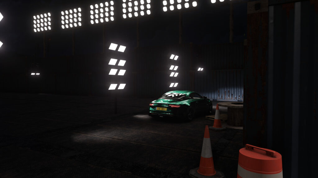 Stunning Green Alpine A110 Sportscar in Industrial Night Setting 4K Desktop Wallpaper