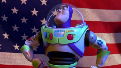 Buzz Lightyear Standing Proudly Before an American Flag Desktop Wallpaper