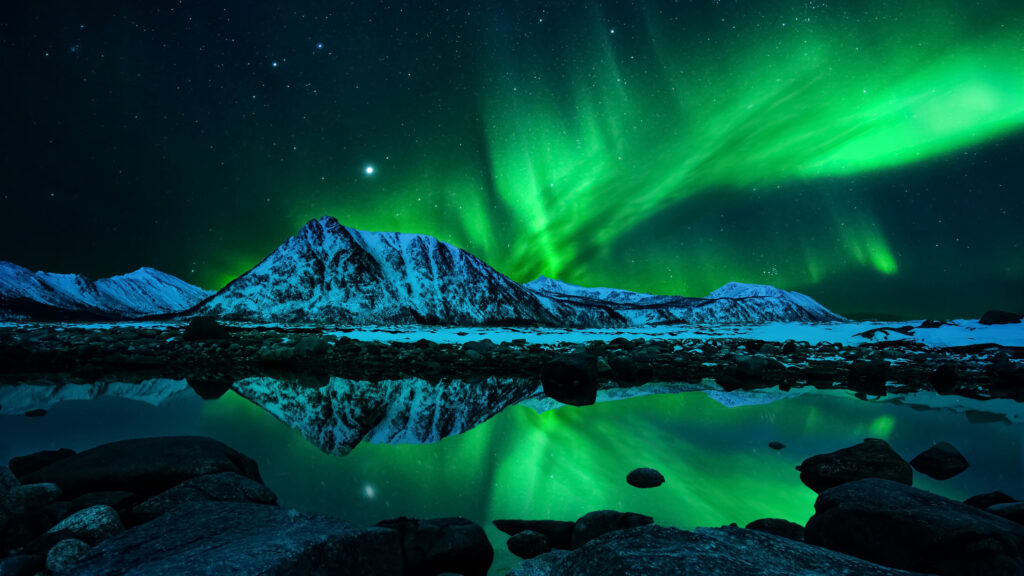 Breathtaking Northern Lights Over Snowy Mountain Desktop Wallpaper