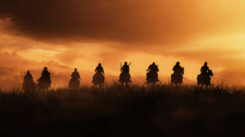 Silhouette of Cowboys Riding at Sunset 4K Desktop Wallpaper