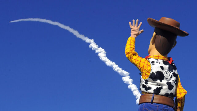 Sheriff Woody Waving at a Rocket Launch 4K Desktop Wallpaper
