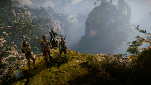 Four Fantasy Heroes Overlooking a Misty Waterfall Desktop Wallpaper