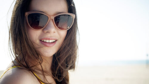 Close-up Portrait of a Smiling Young Woman Desktop Wallpaper