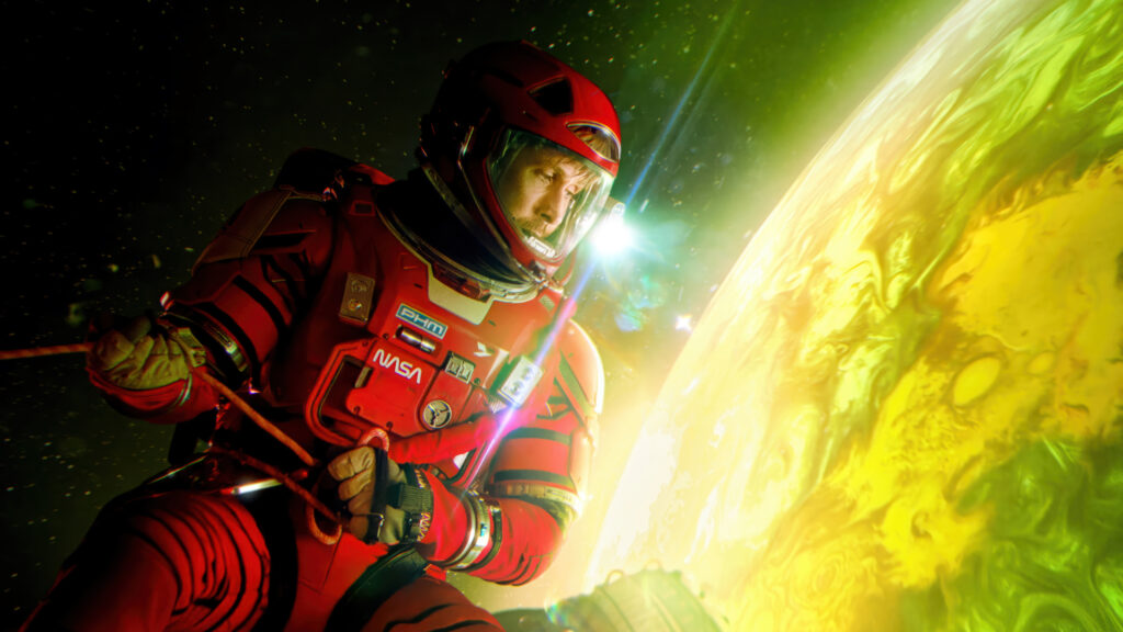 Astronaut in Red Spacesuit Near a Glowing Planet Desktop Wallpaper