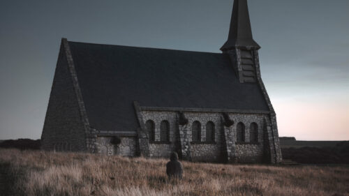 Lone Wanderer at the Stone Chapel Desktop Wallpaper