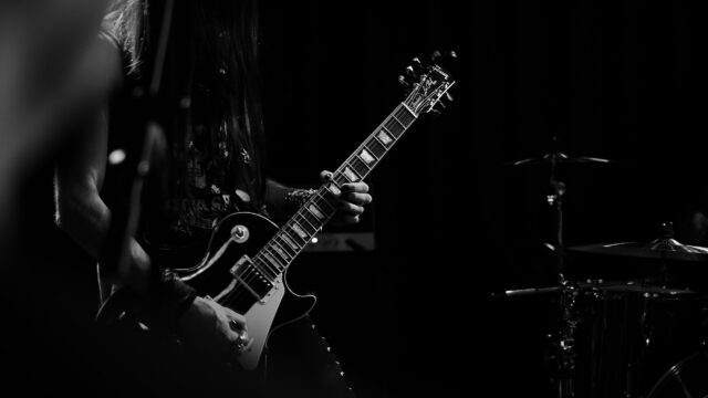 Guitarist Performing on Stage Desktop Wallpaper