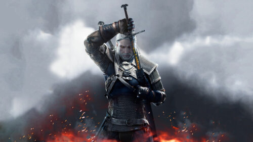 Geralt of Rivia Holding Sword Dark Fantasy Desktop Wallpaper