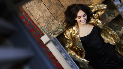 Elegant Woman in Gold Sequin Jacket Desktop Wallpaper