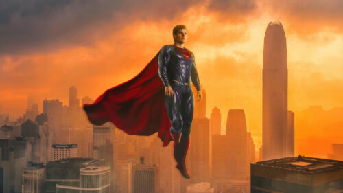 Superman Soaring Over a Golden Cityscape Desktop Wallpaper