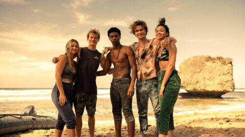 Outer Banks Cast Standing on a Sunny Beach Desktop Wallpaper