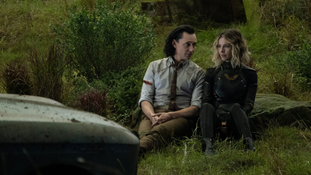 Loki and Sylvie Sitting in Nature Desktop Wallpaper