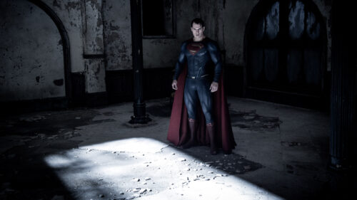 Superman standing in a dark ruined building Desktop Wallpaper