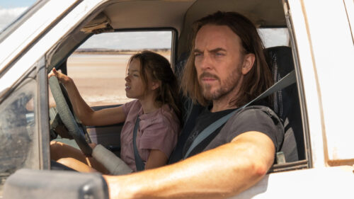 Milly Alcock and James Mackay in a desert truck Desktop Wallpaper