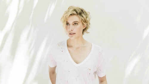 Portrait of Greta Gerwig in a White V-Neck Desktop Wallpaper