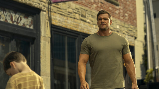 Jack Reacher Walking Past Child in City Scene 4K Wallpaper