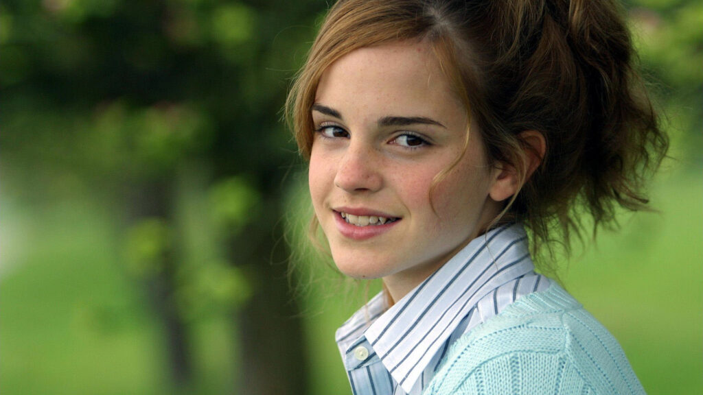 Emma Watson Smiling in a Light Blue Cardigan Desktop Wallpaper