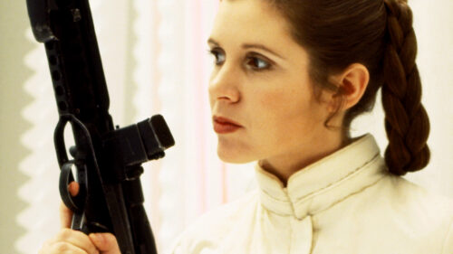 Carrie Fisher as Princess Leia Holding a Blaster Desktop Wallpaper