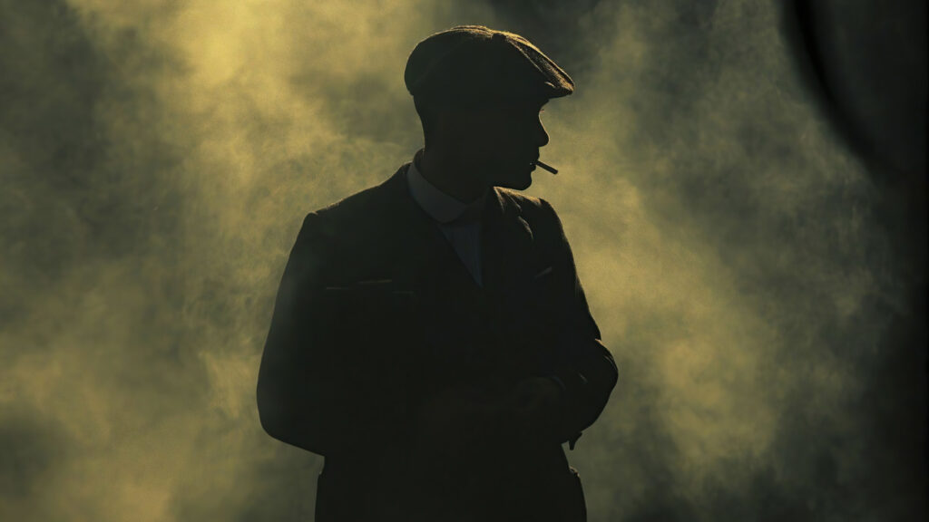 Silhouette of a Man in a Flat Cap Desktop Wallpaper