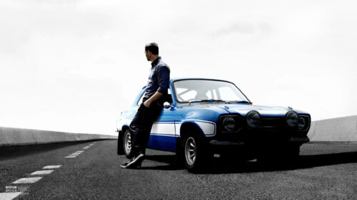 Paul Walker Leaning on a Blue Ford Escort MK1 4K Wallpaper