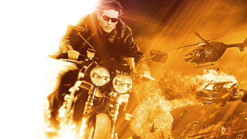 Tom Cruise on Motorcycle in Action Scene Desktop Wallpaper