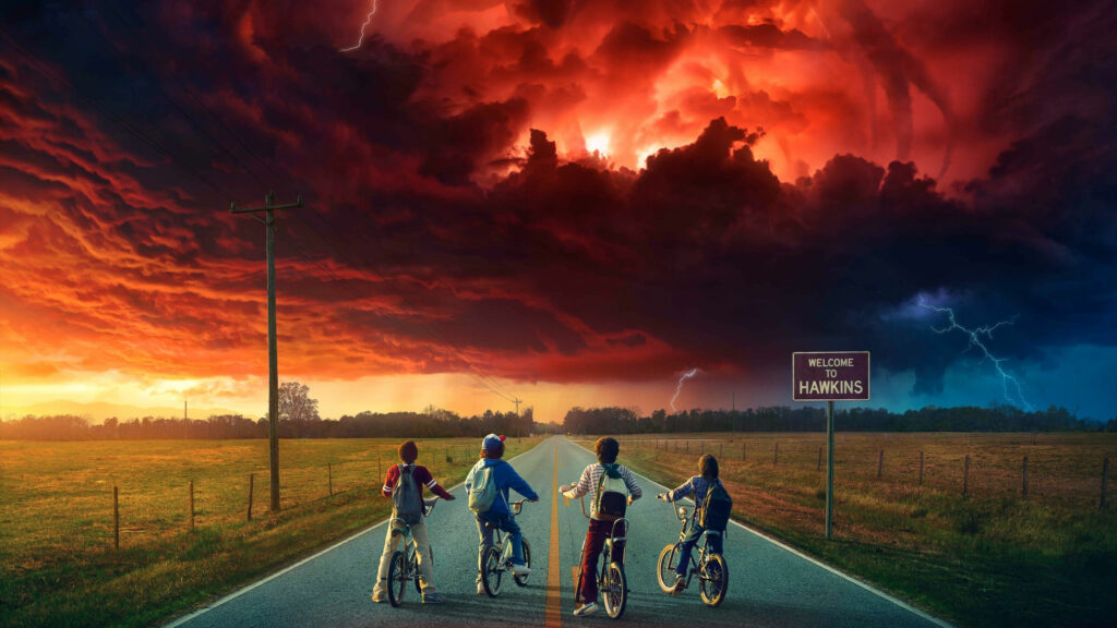 Four Kids Riding Bicycles on Rural Road Desktop Wallpaper