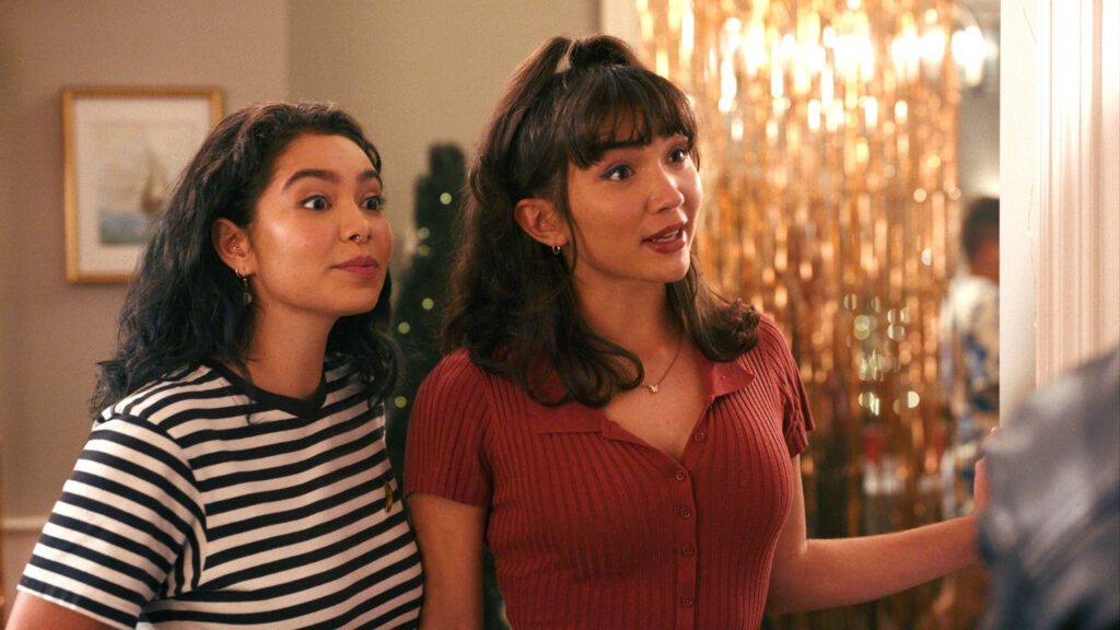 Two Young Women Smiling at a Party Desktop Wallpaper