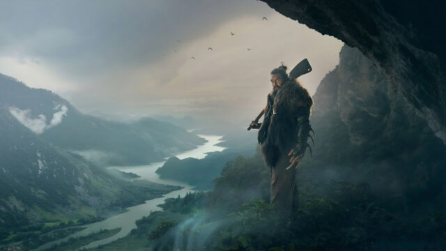 Warrior Overlooking a Misty Mountain Valley Desktop Wallpaper