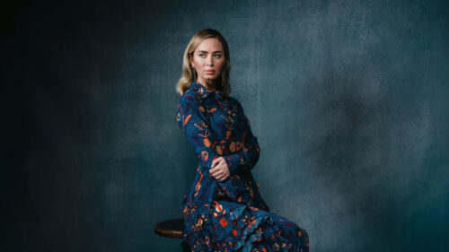 Portrait of Emily Blunt in a Patterned Blue Dress Desktop Wallpaper