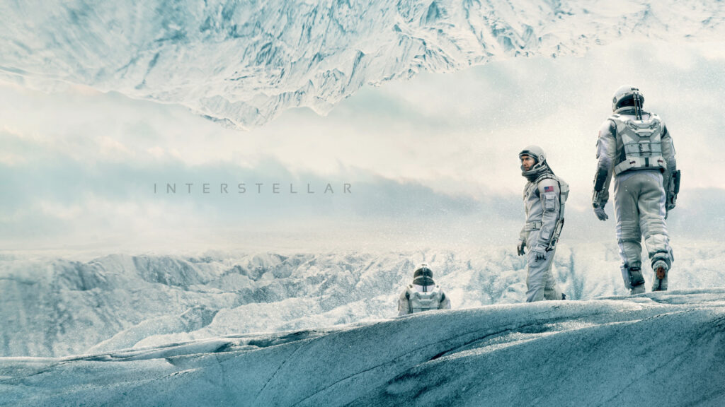 Interstellar Astronauts Exploring an Icy Alien Landscape Desktop Wallpaper