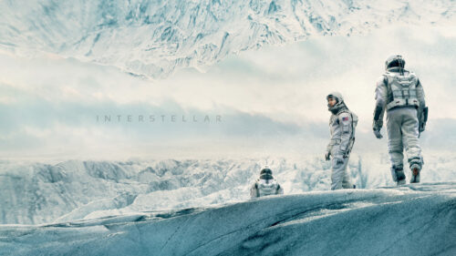 Interstellar Astronauts Exploring an Icy Alien Landscape Desktop Wallpaper