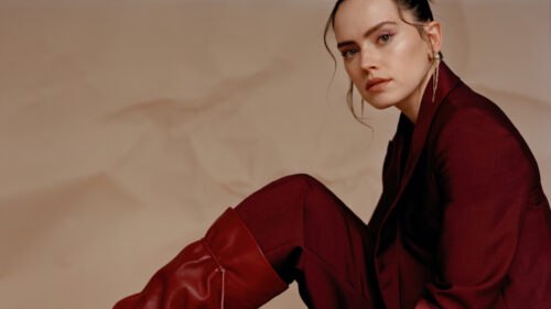 Elegant Portrait of a Woman in a Burgundy Suit Desktop Wallpaper
