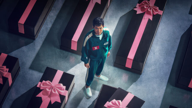 Squid Game Character Among Gift-Wrapped Coffins 4K Wallpaper