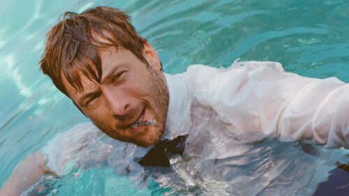 Glen Powell In White Shirt Swimming Pool Desktop Wallpaper