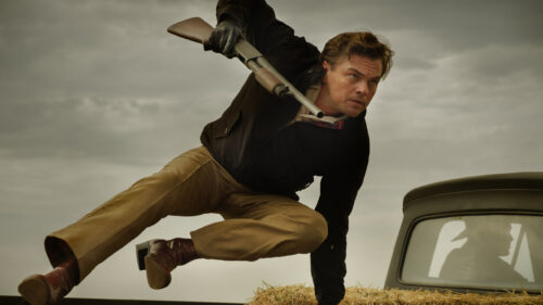 Action scene featuring a man with a shotgun Desktop Wallpaper