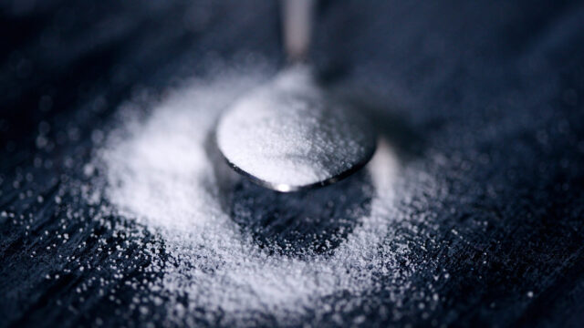 Extreme Close Up White Salt Granules on a Dark Surface Desktop Wallpaper