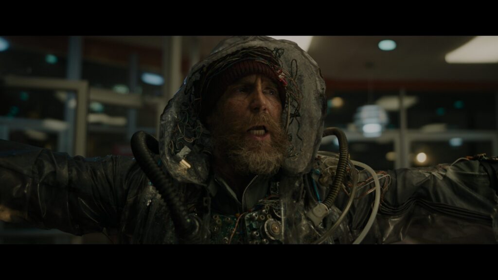 Scruffy Man in Tech Suit Desktop Wallpaper