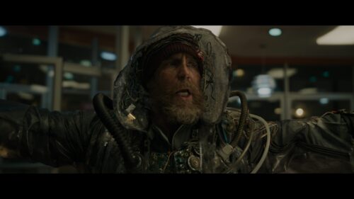 Scruffy Man in Tech Suit Desktop Wallpaper