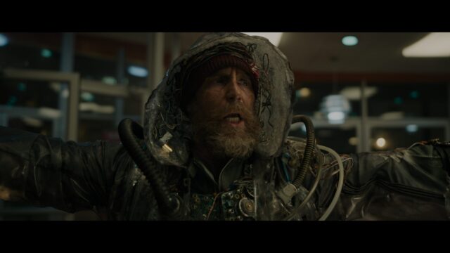 Scruffy Man in Tech Suit Desktop Wallpaper
