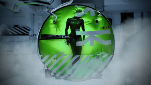 Futuristic Green Bio-Pod Encapsulated Figure Desktop Wallpaper